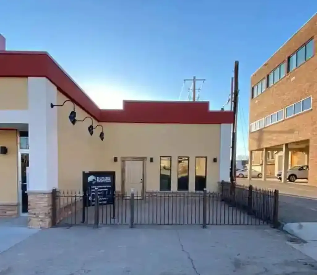 Commercial building with custom metal security fencing