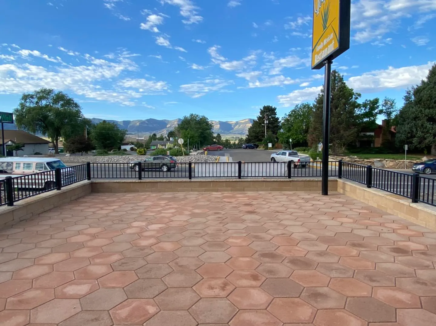 Modern commercial patio railing installation with scenic mountain views