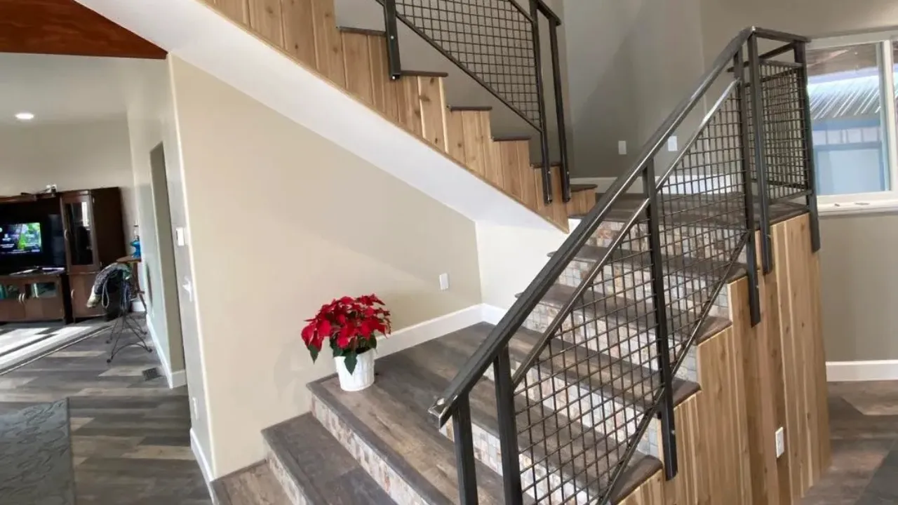 Modern interior staircase with contemporary metal mesh handrail system