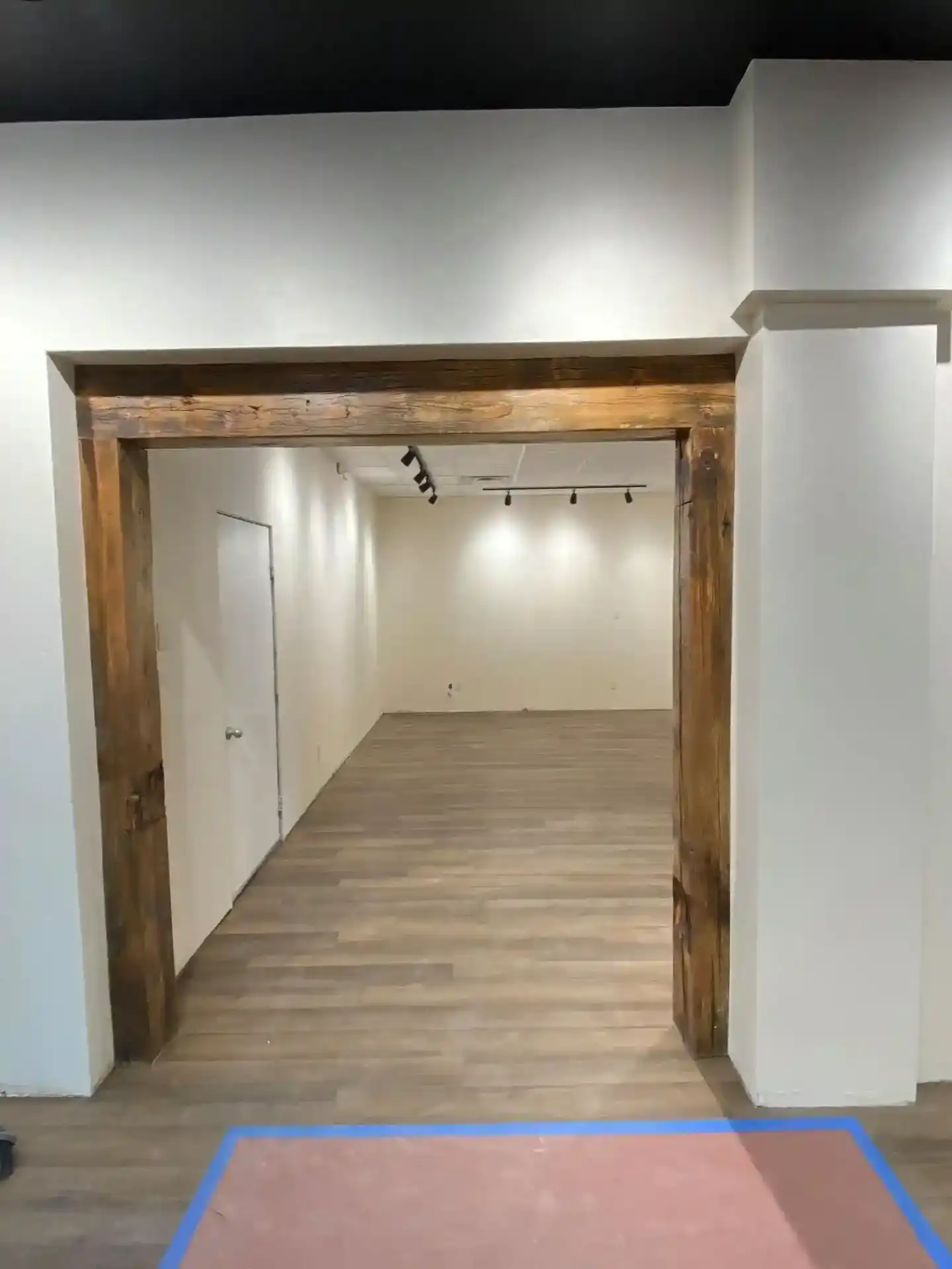 Interior structural wooden beam framework with custom metal support elements