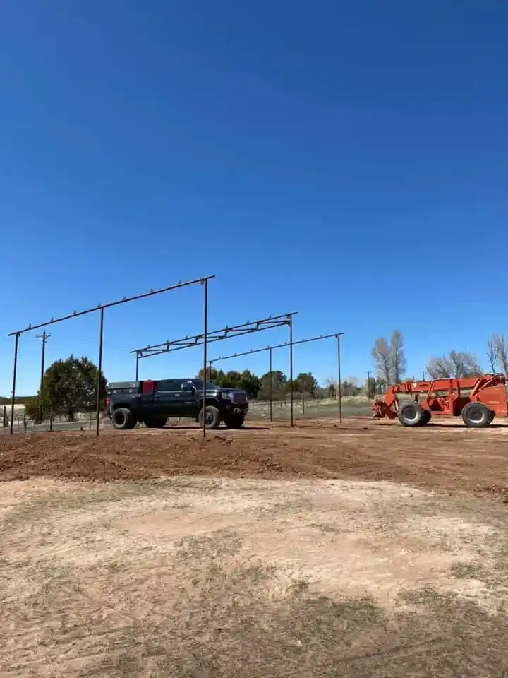 Large scale metal framework construction with heavy equipment and machinery