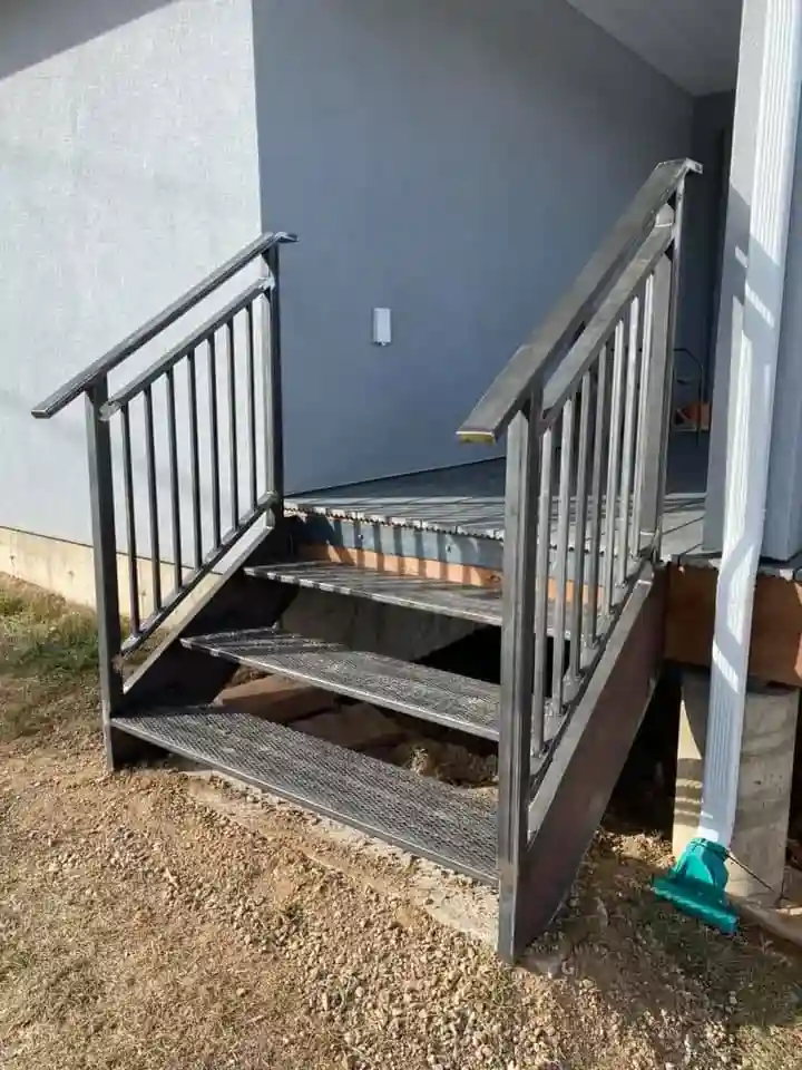 Custom metal steps with safety railing system for commercial building access
