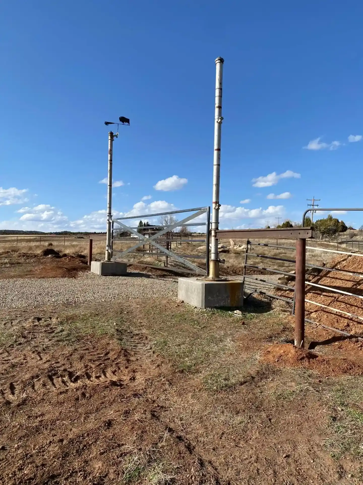 Metal gate with integrated weather station and monitoring equipment