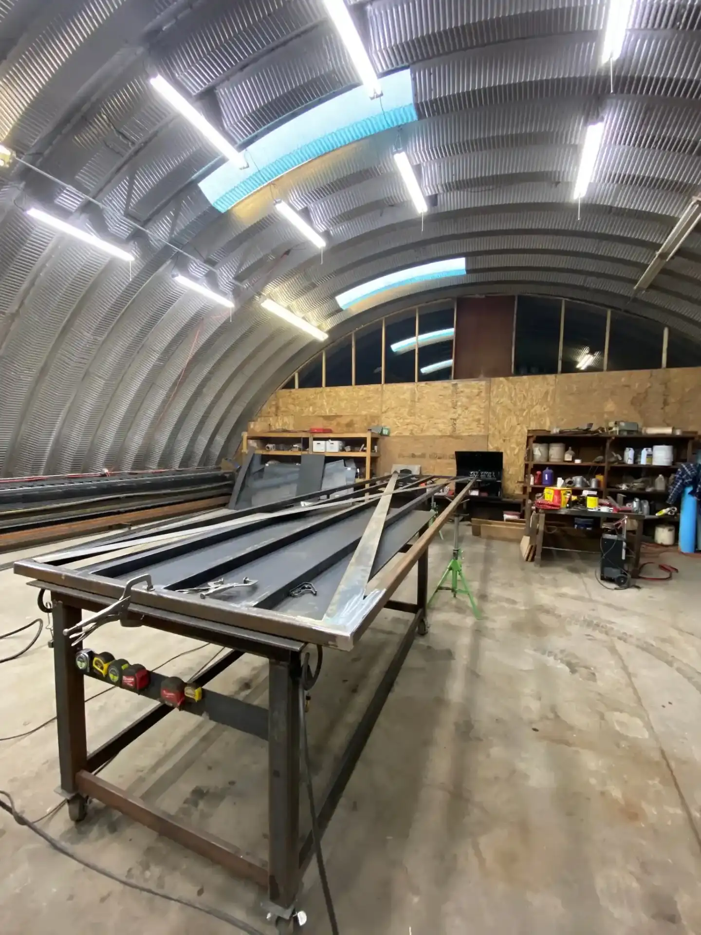 Professional welding workshop with metal fabrication equipment