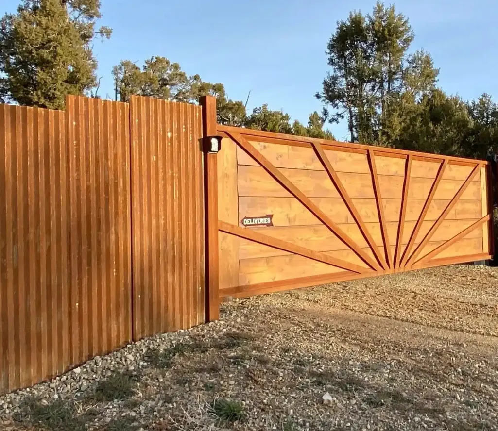 Custom wooden gate with decorative metal framework
